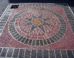 A wider view of the stencil concrete sundial in Dorset.